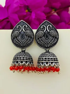 Alluring Oxidized Silver Peacock Design Jhumkas With Red Bead Hangings