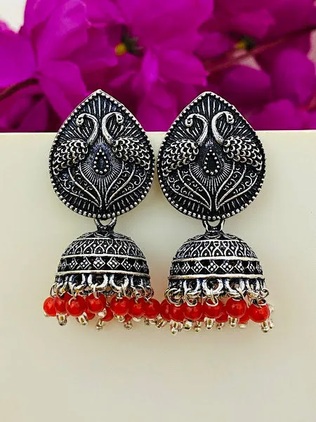 Alluring Oxidized Silver Peacock Design Jhumkas With Red Bead Hangings